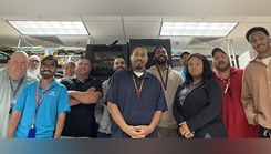 The Defense Health Agency team and Kenner's Information Management Department stand together after successfully completing the clinic-wide network upgrade.