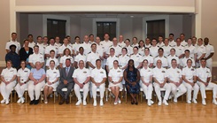 The Naval Medical Center Camp Lejeune Graduate Medical Education Directorate is pictured at the Family Medicine Residency and Sports Medicine Fellowship graduation ceremony