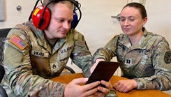 U.S. Army Capt. Annika Zimmerman, hearing program manager and audiologist at Bayne-Jones Army Community Hospital, conducts a hearing protection fit test using the Wireless Automated Hearing Test System