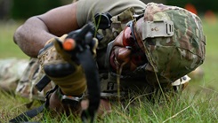U.S. Air Force Lt. Col. Alan Barrett, a clinical provider with the 169th Medical Group, 169th Fighter Wing, South Carolina National Guard, acts as a casualty for care under fire drills during the Tactical Combat Casualty Care Tier 4 course
