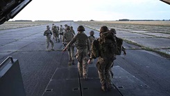 British Army medics from the 16 Medical Regiment and U.S. Airmen assigned to 352d Special Operations Wing, Royal Air Force Mildenhall, practice transporting a simulated injured soldier out of an MC-130J Commando II 