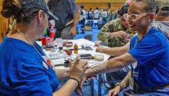 An American Red Cross Yokosuka, Japan, volunteer applies moulage to a role player during Exercise Big Rescue Kanagawa 2026