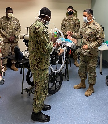 Students and instructors in the METC Respiratory Therapist program practice safe distancing and wear face coverings while training with mechanical ventilators. (Photo by Oscar Lopez)