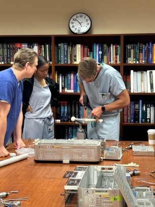 NMCSD Orthopaedic Surgery residents work with a vendor to familiarize themselves with new equipment.