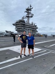 LT Scott Hoener (PGY-4 Psych resident) and CDR David Nissan (Psychiatry Program Director) underway onboard the USS Carl Vinson to provide psychiatry support to a flight squadron (just completed a 10K run around the flight deck).