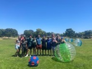 NMCSD Psychiatry residents enjoy a game of Bubble Soccer.  