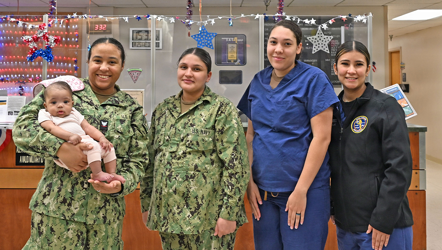  From the left, Hospital Corpsman 3rd Class Mikaela Pierre holds four-month-old daughter Alexandria, Hospital Apprentice Elizabeth Dickey, Hospital Corpsman 3rd Class Azeriah Hunt and Hospitalman Chelsea Marquez served together the same year while pregnant.