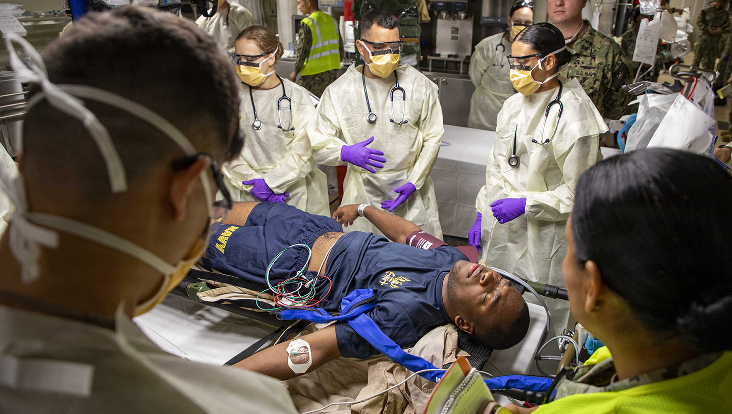 Sailors assigned to the Expeditionary Medical Unit (EMU-2) evaluate a simulated casualty during the unit's Operational Readiness Evaluation
