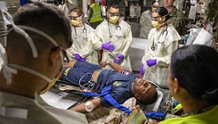 Sailors assigned to the Expeditionary Medical Unit (EMU-2) evaluate a simulated casualty during the unit's Operational Readiness Evaluation