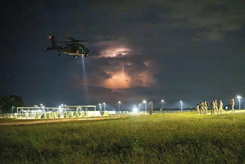 A UH-60 Black Hawk helicopter conducts nighttime operations during Operation Tuskegee Thunder