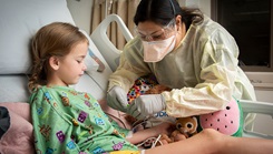 A doctor working on a patient