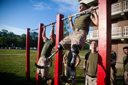 Lance Cpl. Adrian Simone, an infantryman with 1st Battalion, 6th Marine Regiment, from Montville, N.J., does pull-ups at Camp Lejeune, N.C., May, 08, 2012. Simone lost both of his legs to an improvised explosive device in August, 2011 in Helmand province, Afghanistan. DoD photo by Cpl. Jeff Drew