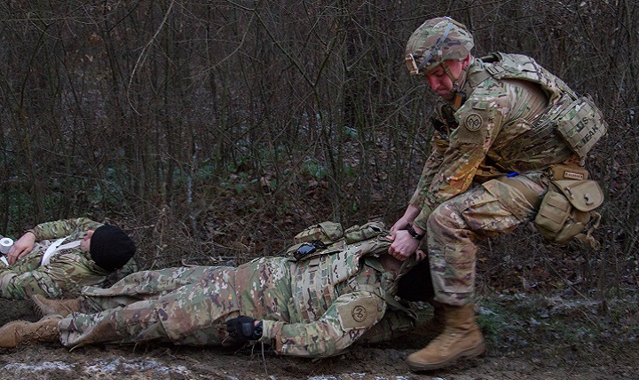 Army Spc. Caleb Bailey, a combat medic assigned to the Joint Multinational Training Group – Ukraine moves a casualty during a mass casualty exercise. The Defense Department and Food and Drug Administration jointly launched a program, Jan. 16, 2018, to expedite developing and delivering new medical products to the warfighter. (U.S. Army photo by Sgt. Alexander Rector)