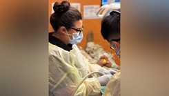 March 5 at the Joint Readiness Training Center and Fort Polk, Louisiana, Capt. Tony Song, dentist, and Misty Fumi, a Red Cross Dental Assistant Program student, provide dental care to a Soldier at the Shira Dental Clinic