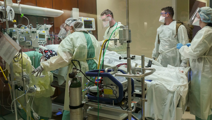 Trauma personnel receive an extracorporeal membrane oxygenation or ECMO patient into the Emergency Department at Brooke Army Medical Center, Joint Base San Antonio-Fort Sam Houston, Texas, Jan. 24, 2022. BAMC has been re-verified as a Level I Trauma Center by the American College of Surgeons for its dedication to providing optimal care for injured patients.