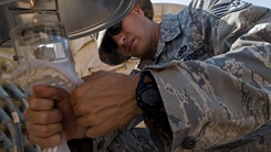 Staff Sgt. Adrian Pozo-Romero examines sand fly light traps
