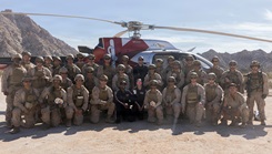 U.S. Marines and Sailors with 1st Combat Engineer Battalion, 1st Marine Division, assigned to Joint Task Force-Southern Border (JTF-SB), and AeroCare Headquarters pose for a group photo after a simulated medical evacuation