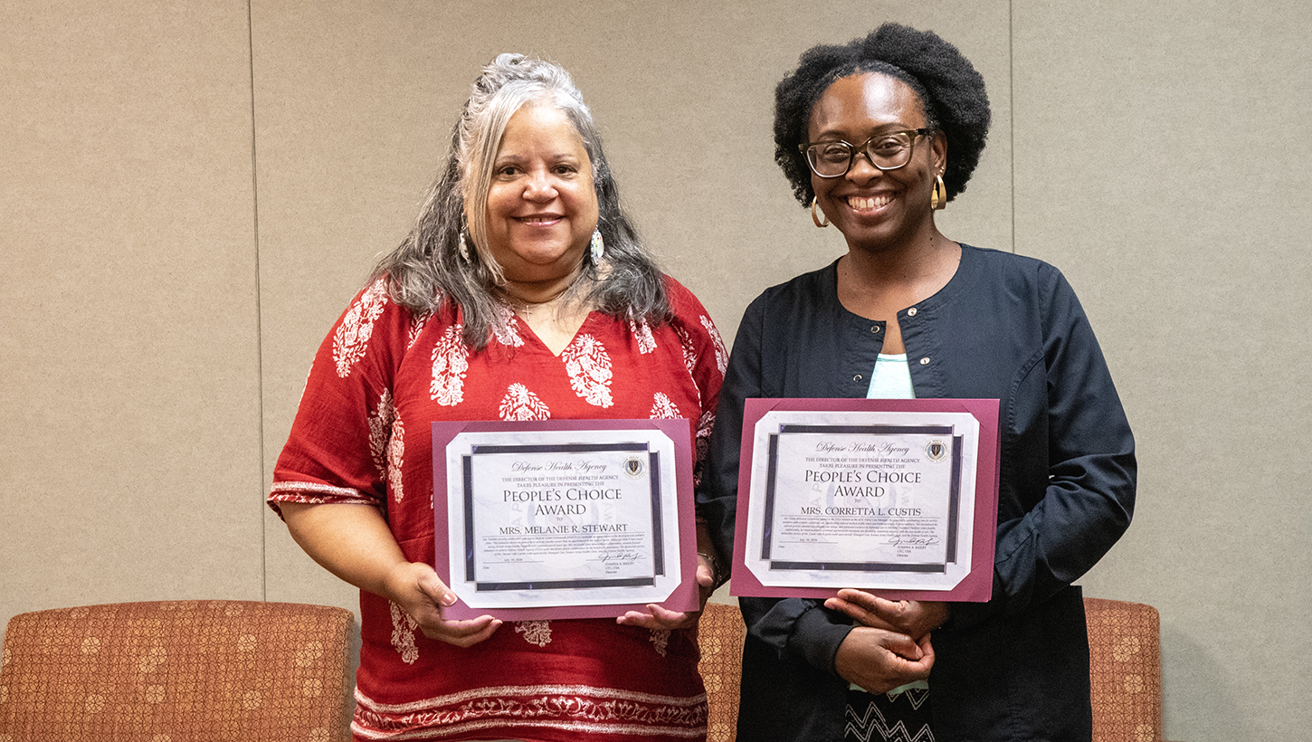 Melanie Stewart, left, and Corretta Custis, right, display their People’s Choice Awards 