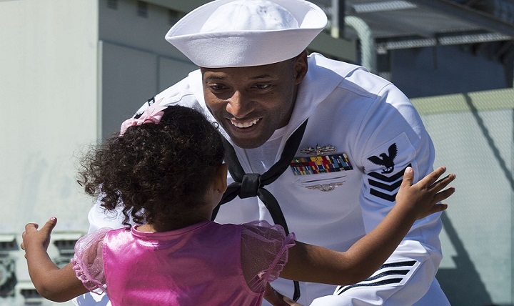 Sailor and daughter embrace