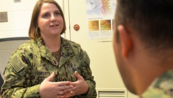 Lt. Allison Conforte, a clinical psychologist at Naval Hospital Jacksonville, discusses mental health with a sailor.