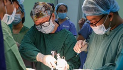 Navy Petty Officer 1st Class Emily Day, a surgical technician, works with local surgeons during a surgery at General Hospital in Quang Ngai, Vietnam