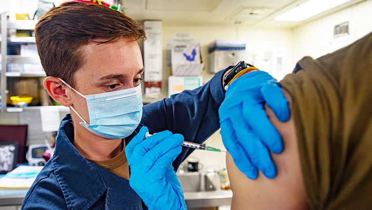 Image of Soldier getting flu shot. Click to open a larger version of the image.