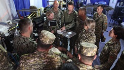 ERSS 9 team members Lt. j.g. Erin Moore, Lt. Cmdr. Brent Buccine, CDR Jacob Adam’s, and CDR John Maddox demonstrate role 2 trauma and assessment capabilities during Operation Bright Star 25, Mohamed Najuib Military Base, Egypt, Sep. 4, 2025. (U.S. Central Command photo by Maged Benjamin-Elias)