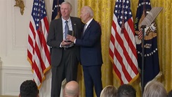 Dr. Frank Butler accepting an award from President Joe Biden