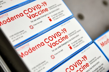 Image of several boxes of Moderna COVID-19 vaccines