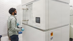  The large microscope pictured here captures thousands of images of a particle, which are then computationally reconstructed into a 3D structural map.