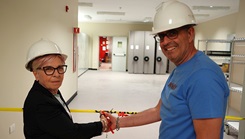  Ms. Nellie Barone, Acquisition Division Officer, and Mr. Nicola Digregorio, Facility Engineer, Local National team members of U.S. Naval Hospital (USNH) Sigonella, symbolically cut the caution tape marking the reopening of the renovated Materials Management warehouse at USNH Sigonella
