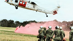 U.S. Navy Hospital Corpsman assigned to Navy Medicine Readiness and Training Command (NMRTC) Patuxent River transport a simulated casualty on a litter toward an MH-60S Sea Hawk helicopter