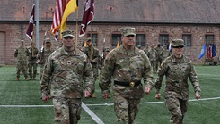 Public Health Command Europe’s outgoing commander, Col. Paul Lang, Brig. Gen. Roger Giraud, Medical Readiness Command, Europe and incoming commander, Col. Anastasia McKay, returning after they passed the colors.