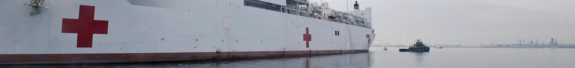 The Military Sealift Command hospital ship USNS Comfort pulls away from Canton Pier for a short notice humanitarian deployment to Port-au-Prince, Haiti. The ship, with a crew of nearly 850 personnel including 550 U.S. Navy medical service members, will assist other U.S. Armed Forces elements, non-profit humanitarian organizations and search and rescue teams from around the world in bringing relief to Haitians displaced by the Jan. 12 earthquake. Comfort's Medical Treatment Facility has the capability to provide significant medical care through an emergency operating rooms, ward beds, a casualty reception area, pharmacy and intensive care area.