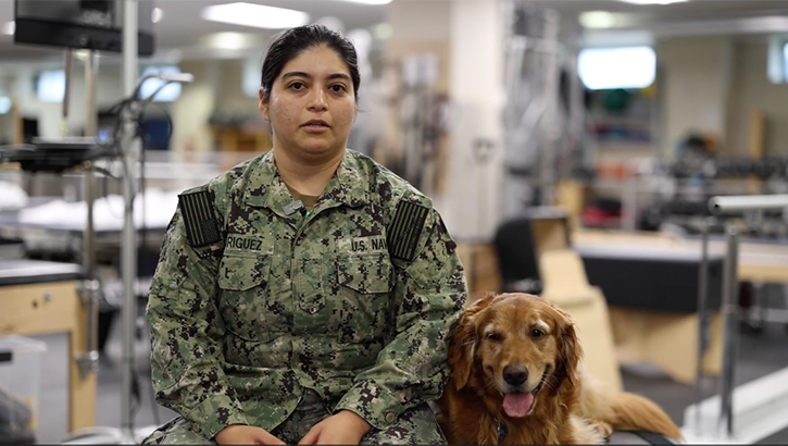 Hospital Corpsman Ajanae Rodriguez, assigned to Walter Reed National Military Medical Center's emergency department, speaks on the impacts of facility dogs at Walter Reed in the Military Advanced Training Center at Walter Reed in Bethesda, Maryland, June 28, 2023. 