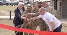 Military personnel ribbon cutting