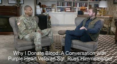 Military personnel discussing the Armed Services Blood Program