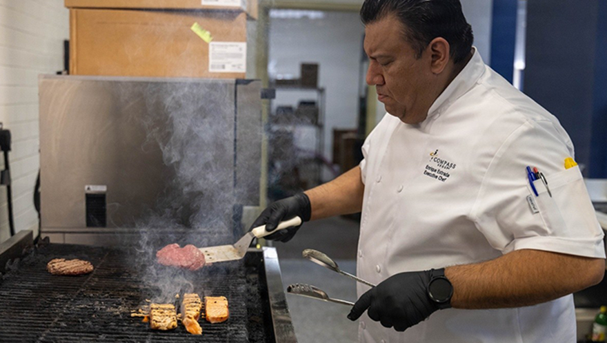 A chef in 42 Bistro cooking