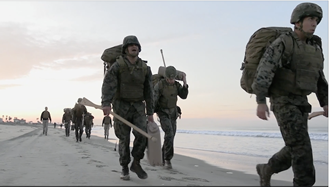 Link to Video: Military personnel walking on the beach