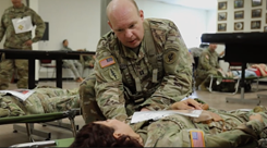 Military personnel talking to each other