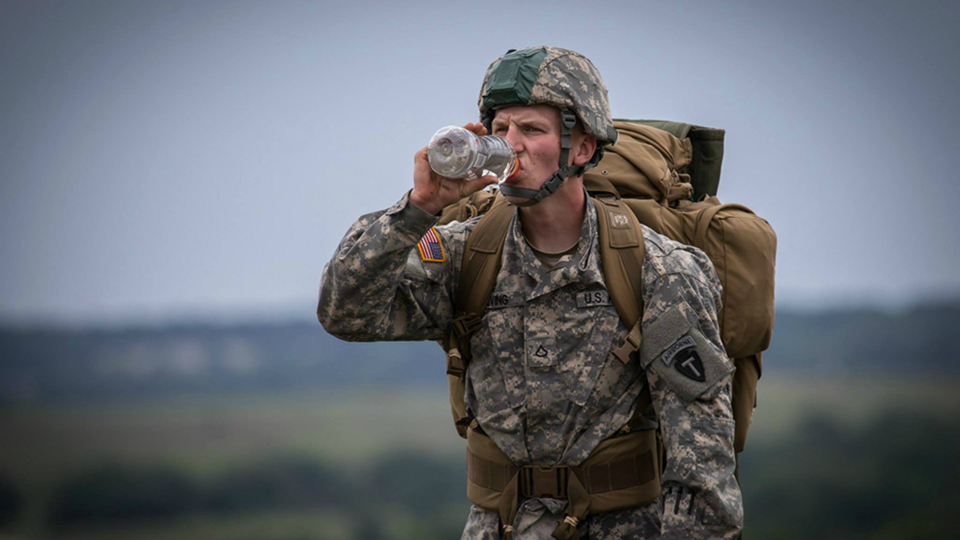 Military personnel drinking water